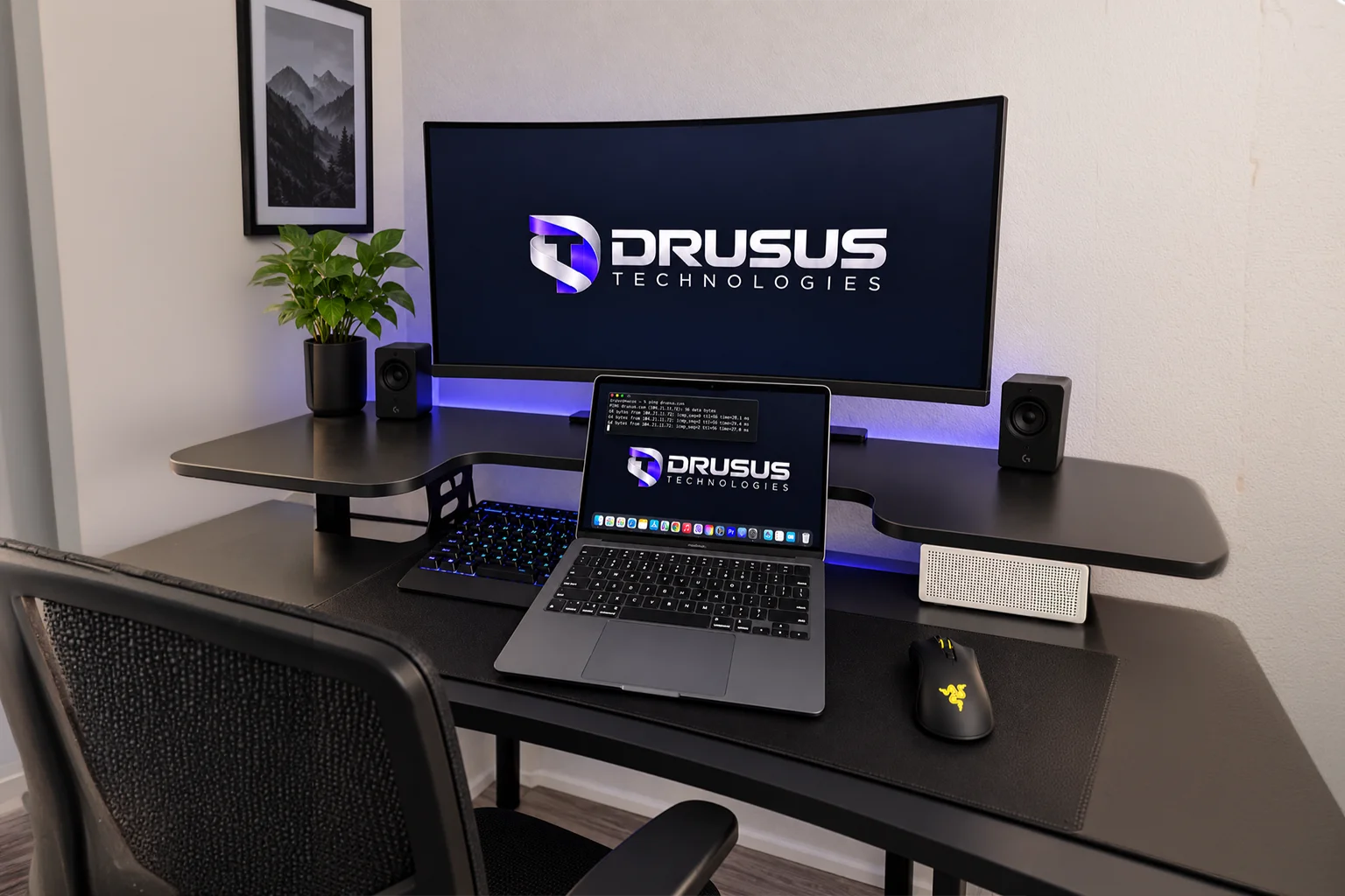 Drusus Technologies workstation with a branded monitor and laptop displaying a terminal